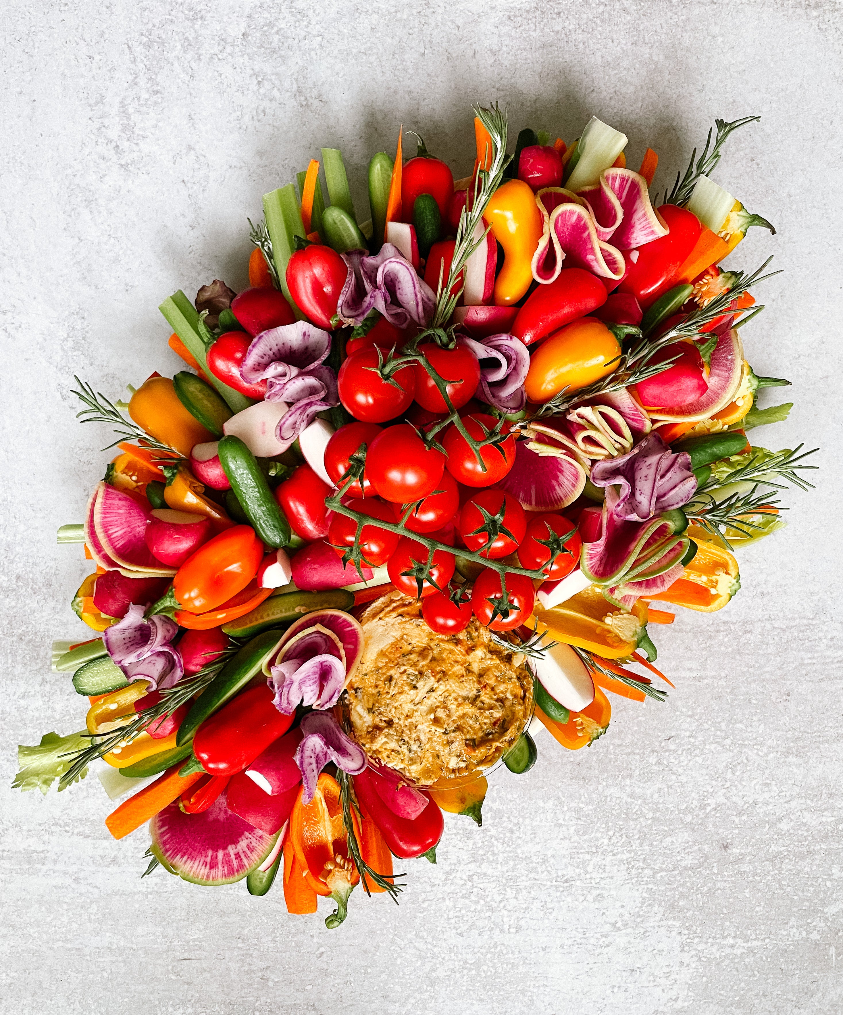 Colorful arrangement of vegetables and  on a light gray background